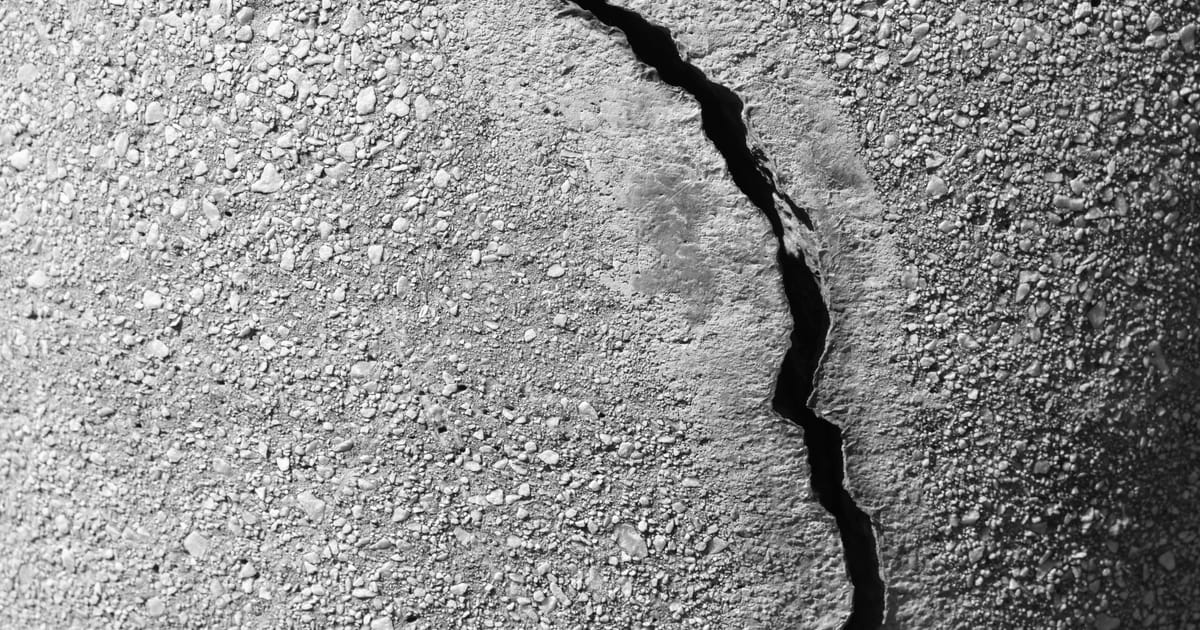 Crack running through a concrete surface