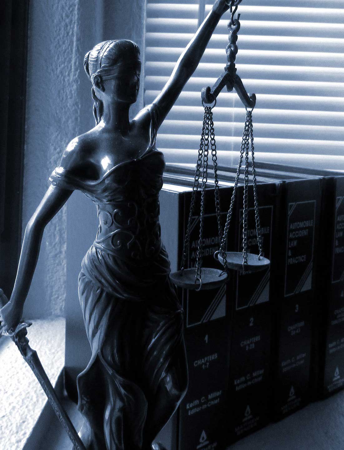 Litigation sculpture with the scales of justice representing the fair and balanced legal system in Alberta