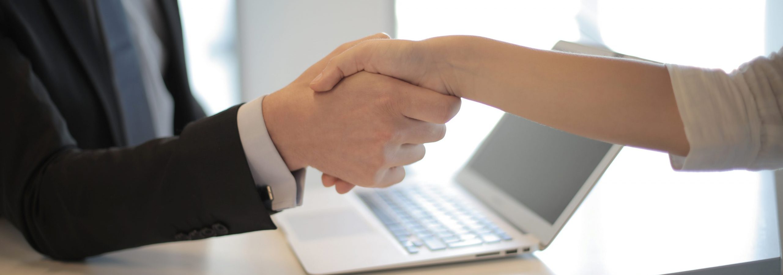 Employee and Employer shaking hands